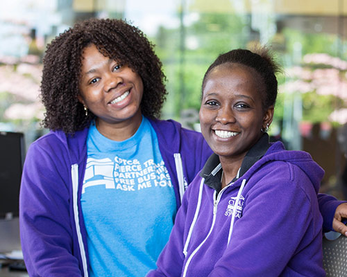 Two CPTC students smiling together on campus