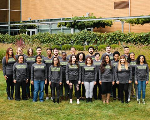 Group of ASG employees wearing long sleeve grey shirts