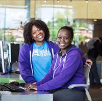 Two ladies at SLSC desk